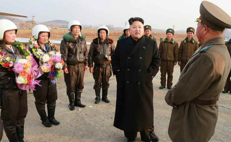 Illustration for article titled Kim Jong Un Visits Female Fighter Pilots, Picks Up Camera For Photo Op